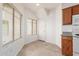 Eat in Kitchen with two windows and white appliances at 6770 N 47Th Ave # 1022, Glendale, AZ 85301