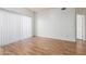 Empty living room with wood floors and large window allowing lots of natural light at 6770 N 47Th Ave # 1022, Glendale, AZ 85301