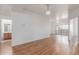 Bright and open living space with wood floors connecting to the bathroom and patio at 6770 N 47Th Ave # 1022, Glendale, AZ 85301