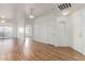 Bright living room with wood floors and sliding glass doors to patio at 6770 N 47Th Ave # 1022, Glendale, AZ 85301