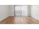 Empty living room with wood floors and large window allowing lots of natural light at 6770 N 47Th Ave # 1022, Glendale, AZ 85301