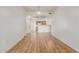 Open-concept living room with hardwood floors and view of the kitchen at 6770 N 47Th Ave # 1022, Glendale, AZ 85301