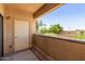 View of a shaded patio with a white storage closet, and low rise concrete wall at 6770 N 47Th Ave # 1022, Glendale, AZ 85301