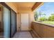 Cozy patio features a sliding glass door, and a white storage closet at 6770 N 47Th Ave # 1022, Glendale, AZ 85301