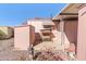 A charming backyard features an angel statue, shade structure, and pink exterior at 701 S Dobson Rd # 432, Mesa, AZ 85202