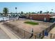 Aerial view of the community dog park with artificial turf and fenced perimeters at 701 S Dobson Rd # 432, Mesa, AZ 85202