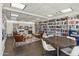 Cozy library with floor-to-ceiling bookshelves, comfortable chairs, and a round table at 701 S Dobson Rd # 432, Mesa, AZ 85202