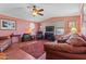 Inviting living room featuring a ceiling fan, laminate flooring and a cozy fireplace at 701 S Dobson Rd # 432, Mesa, AZ 85202