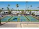 Aerial view of community pickleball courts with parking and mature palm trees at 701 S Dobson Rd # 432, Mesa, AZ 85202