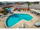 Aerial view of pools, spas, and surrounding lounge areas with desert landscaping at 701 S Dobson Rd # 432, Mesa, AZ 85202