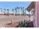 Street view of the home and surrounding neighborhood featuring desert landscaping and mature palm trees at 701 S Dobson Rd # 432, Mesa, AZ 85202