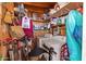 This cluttered utility room contains a washer and dryer, shelving, and other household items at 701 S Dobson Rd # 432, Mesa, AZ 85202