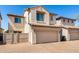 Charming stucco townhome with a two-car garage and fenced entry, offering privacy at 8429 W Vernon Ave, Phoenix, AZ 85037