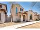 Charming stucco home with a quaint balcony and desert landscaping at 8429 W Vernon Ave, Phoenix, AZ 85037