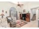 Comfortable living room with a large arched window and decorative accents at 8429 W Vernon Ave, Phoenix, AZ 85037