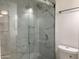 Beautiful bathroom featuring a glass enclosed shower with rainfall showerhead and marble style tile at 850 S River Dr # 2018, Tempe, AZ 85281