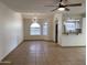 Open living space features tile floors, ceiling fan, dining area and access to the kitchen at 850 S River Dr # 2018, Tempe, AZ 85281