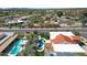 An aerial view of the property highlighting the pool, backyard and the home's beautiful terra cotta roof at 10013 N 106Th Pl, Scottsdale, AZ 85258