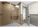 The tiled shower is the focal point of this modern bathroom at 10013 N 106Th Pl, Scottsdale, AZ 85258