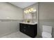 Bright bathroom with double sink vanity and unique lighting fixture at 10013 N 106Th Pl, Scottsdale, AZ 85258