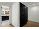 Hallway with black cabinets near the bathroom at 10013 N 106Th Pl, Scottsdale, AZ 85258