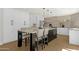 Spacious kitchen features a large center island with pendant lighting and white cabinets at 10013 N 106Th Pl, Scottsdale, AZ 85258