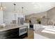 Modern kitchen features stainless steel appliances, light countertops, and plenty of cabinet space at 10013 N 106Th Pl, Scottsdale, AZ 85258
