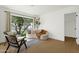 Cozy sitting room with a large window and hardwood floors at 10013 N 106Th Pl, Scottsdale, AZ 85258