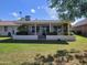 Charming home with a well-manicured backyard and a lovely covered patio area at 11108 W Cameo Dr, Sun City, AZ 85351