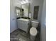 Bathroom with white vanity, gold accents, and stylish decor at 11108 W Cameo Dr, Sun City, AZ 85351