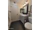 Updated bathroom with gray vanity, stylish mirror, and modern fixtures at 11108 W Cameo Dr, Sun City, AZ 85351