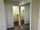 Walk-in closet features shelving and mirrored sliding doors in the main bedroom at 11108 W Cameo Dr, Sun City, AZ 85351