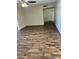 Hardwood floors throughout the open living room and neutral paint colors at 11108 W Cameo Dr, Sun City, AZ 85351