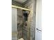 Beautifully tiled shower with glass doors, a convenient built-in niche, and stylish gold fixtures at 11108 W Cameo Dr, Sun City, AZ 85351