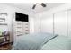Modern bedroom featuring neutral colors, natural light, and sleek furniture for a serene retreat at 12622 W Catalina Dr, Avondale, AZ 85392