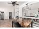 Open floor plan featuring a wood dining table and built-in shelving at 12622 W Catalina Dr, Avondale, AZ 85392