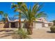 Charming single-story home with a two car garage and desert landscaping with beautiful palm trees at 12622 W Catalina Dr, Avondale, AZ 85392