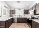 Charming kitchen featuring tile flooring, shutters, and stainless steel appliances at 12622 W Catalina Dr, Avondale, AZ 85392