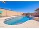 Relaxing backyard with a gorgeous pool and a sun-soaked lounging area, perfect for enjoying the warm weather at 12622 W Catalina Dr, Avondale, AZ 85392