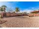 Low maintenance backyard with desert landscaping, palm trees, a covered patio, and block wall fencing at 13008 N 28Th Pl, Phoenix, AZ 85032
