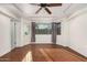 Spacious bedroom with hardwood floors, natural light, and direct access to the outside at 13008 N 28Th Pl, Phoenix, AZ 85032