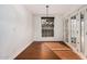 Bright dining room features hardwood floors and French doors to the outdoors at 13008 N 28Th Pl, Phoenix, AZ 85032