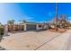 Single-Gathering home featuring a spacious driveway and unique architectural details at 13008 N 28Th Pl, Phoenix, AZ 85032