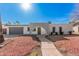 Charming single-story home with an arched entryway and well-maintained front yard at 13008 N 28Th Pl, Phoenix, AZ 85032