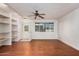 Bright, open living space with hardwood floors and built-in shelving at 13008 N 28Th Pl, Phoenix, AZ 85032