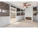Enclosed patio features tile floors, a ceiling fan, screened windows, and a door, providing comfort and outdoor enjoyment at 13008 N 28Th Pl, Phoenix, AZ 85032