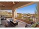 Covered balcony with seating, fireplace, and views of the community and mountains at 13013 N Panorama Dr # 120, Fountain Hills, AZ 85268