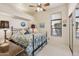 This bright bedroom features a ceiling fan and a double door closet at 13013 N Panorama Dr # 120, Fountain Hills, AZ 85268