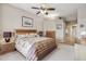 The neutral bedroom includes a ceiling fan, carpeted floors, and natural lighting at 13013 N Panorama Dr # 120, Fountain Hills, AZ 85268