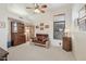 This bedroom offers natural lighting with carpeted floors and a ceiling fan at 13013 N Panorama Dr # 120, Fountain Hills, AZ 85268